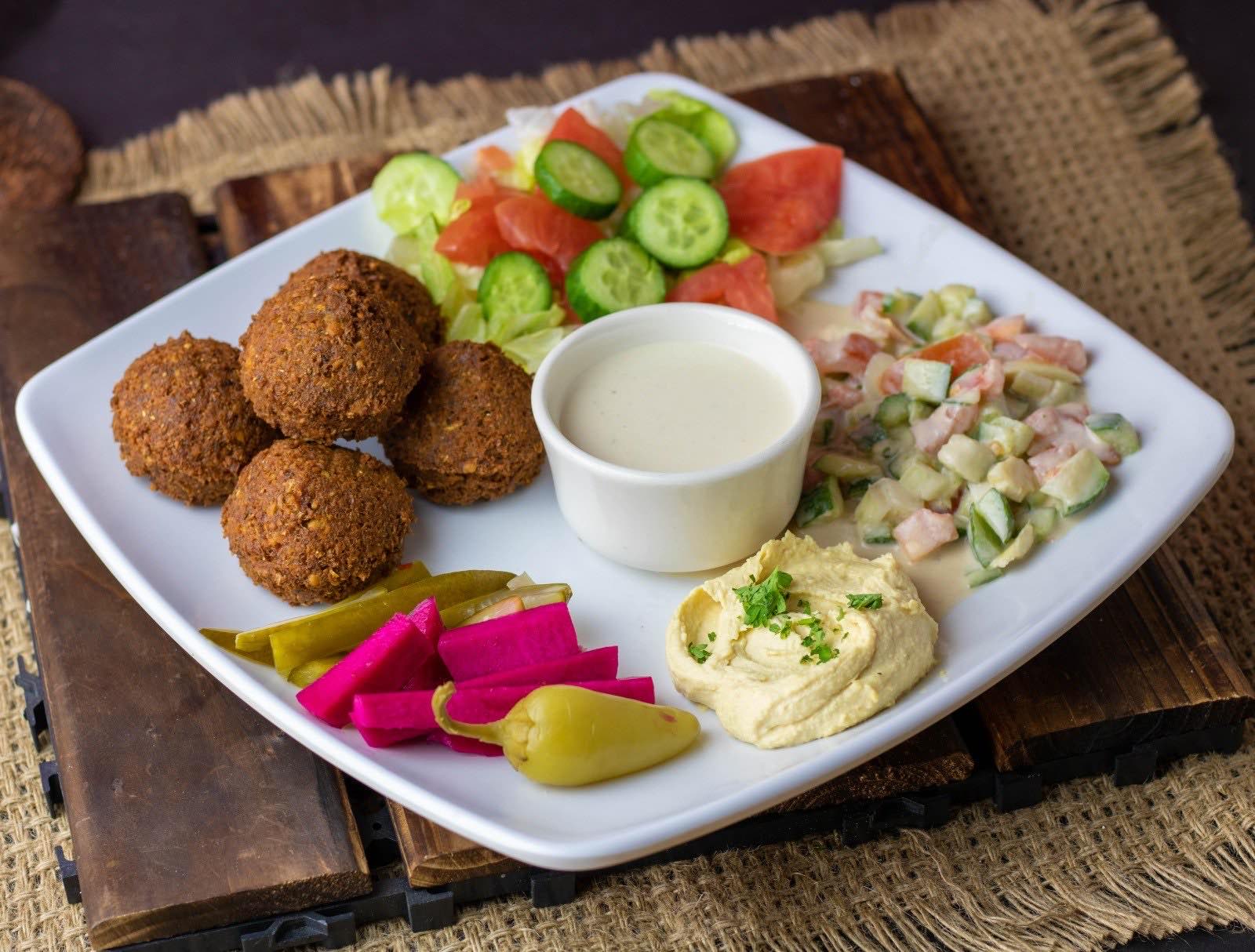 The falafel special plate at Falafel Plus — falafel, salad, tahini, hummus and pickles